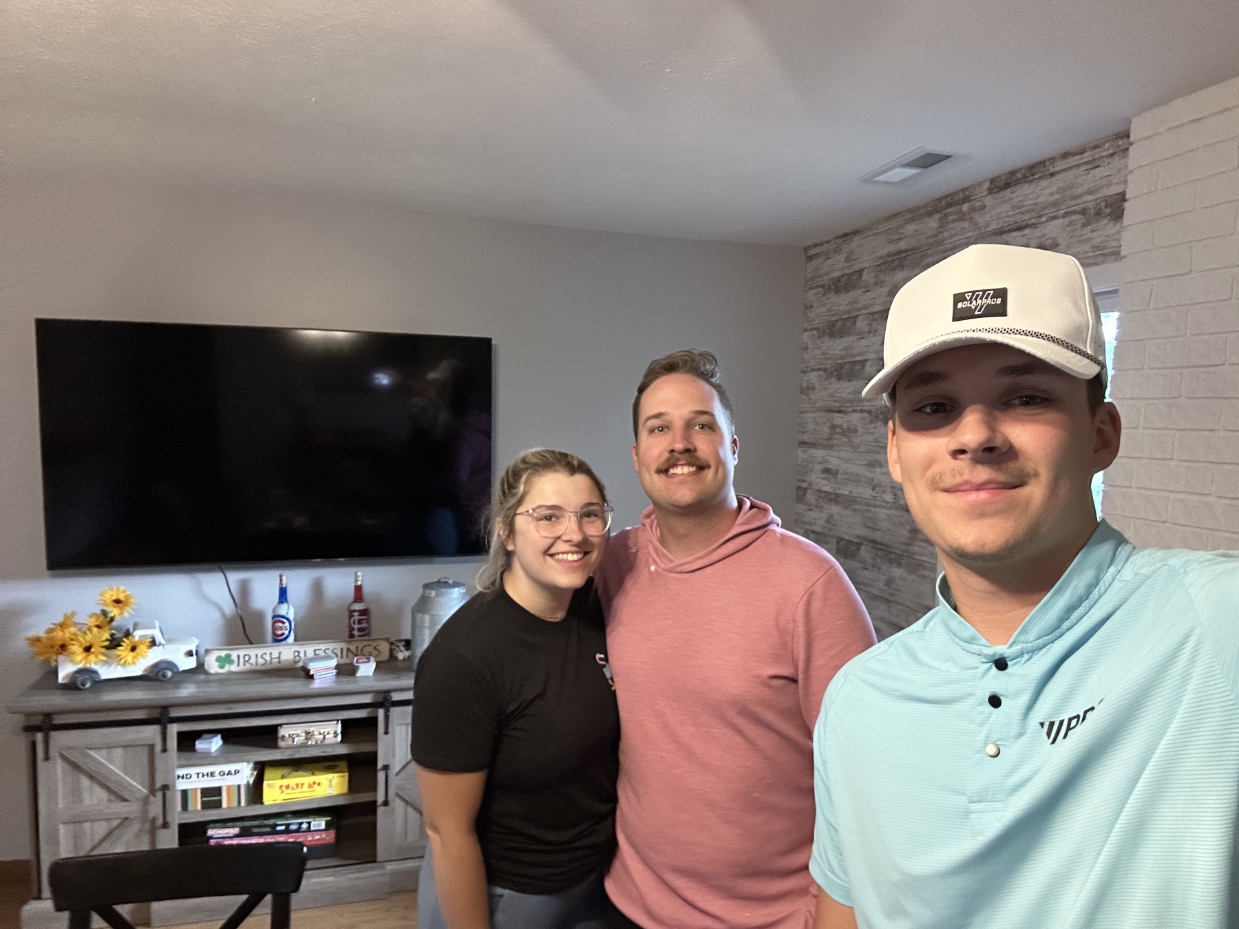 The Brysons smiling after a solar consultation with Vitality